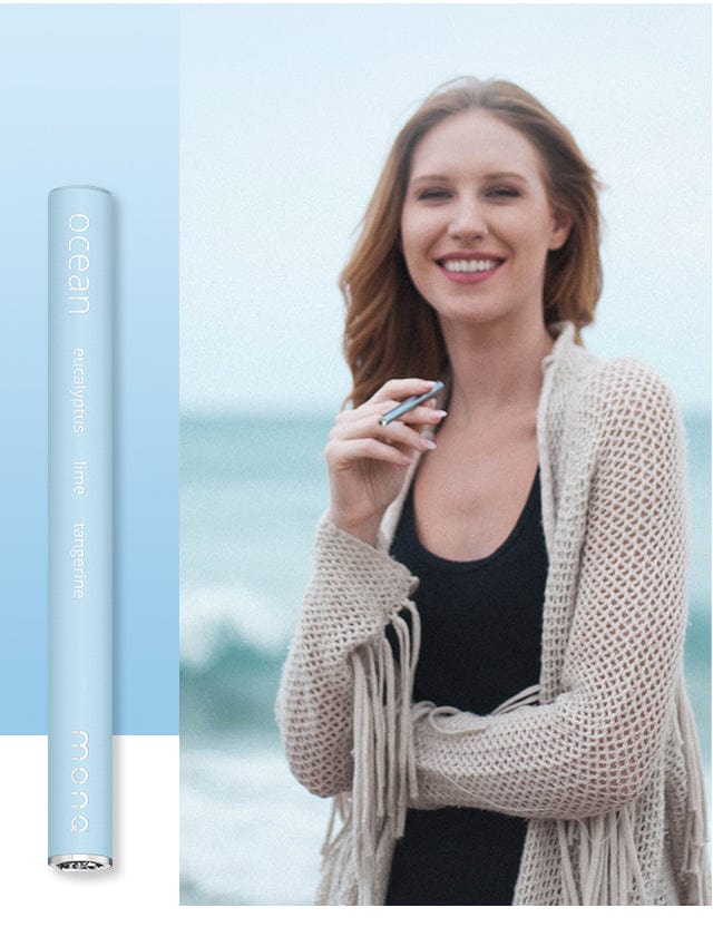 Person enjoying Ocean MONQ aromatherapy at the beach
